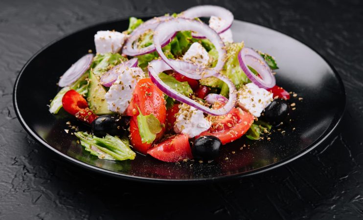 greek-salad-in-black-bowl-on-stone-2023-11-27-05-12-57-utc (1)